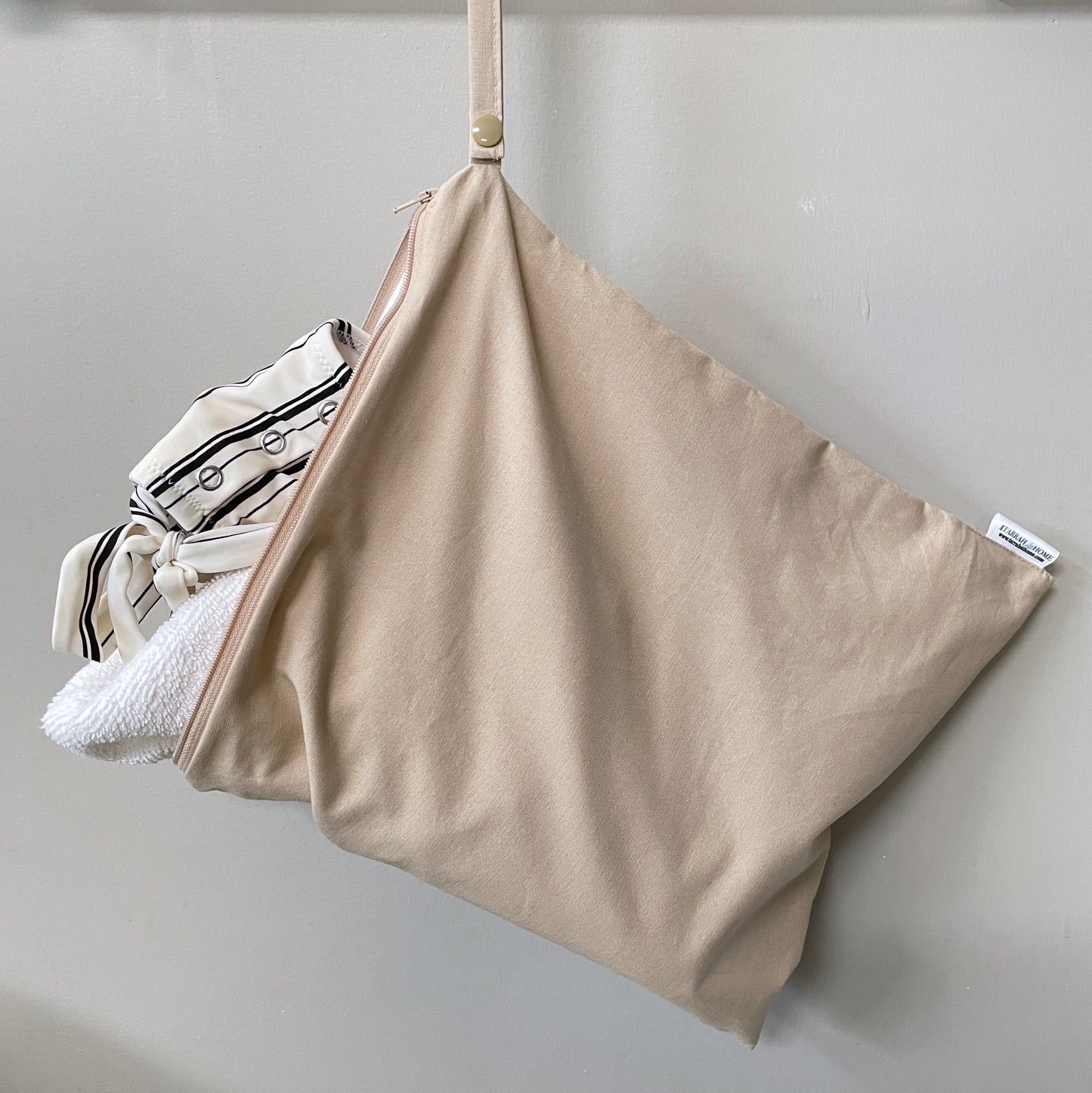 Large wetbag with towel and swimsuit
